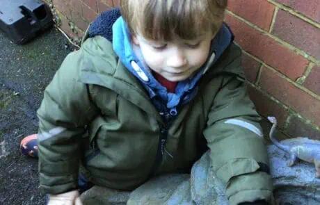 nursery child adding flowers to our garden